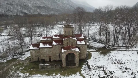 Aerial view of the ancient medieval Christian temple in the Nizhny Arkhyz, R Stock Footage 337534997