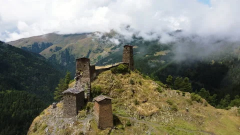Aerial view of ancient monastery ruins on a hill in Caucasus mountains Stock Footage 229880894