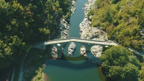 Aerial view of An ancient stone bridge called Devil's bridge Ardino Bulgaria Vídeo Stock 139682931