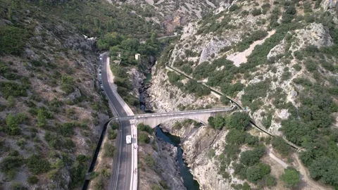 Aerial view of an Ancient Stone Bridge called Devil's Bridge in South of France Stock Footage 196808868