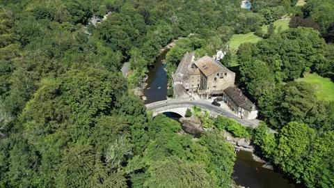 Aerial view of ancient stone bridge over calm river. Yorkshire Dales,  Ribb.. Stock Footage 346290011