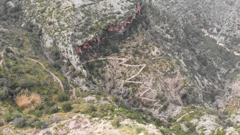 Aerial view of an ancient stone path in Barranc de l'Infern in La Vall de Laguar Stock Footage 123629111