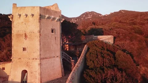 Aerial view of an ancient tower on the cliff at Sunset  Stock Footage 106540742