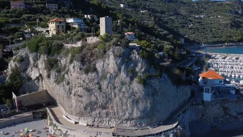 Aerial view of an ancient tower on the mountain of Finale Ligure Stock Footage 253127106