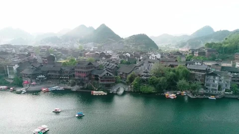 Aerial View of Ancient Town by River with Traditional Architecture Video stock 335461419