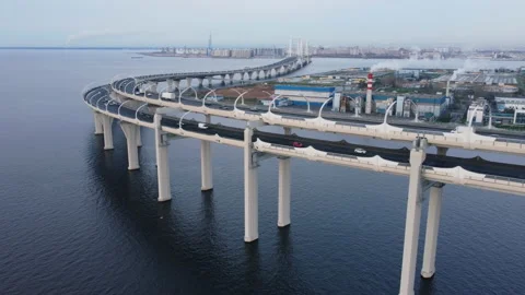 Aerial view and lifting under bypass highway standing on columns at sea bay. Stock Footage 165206549