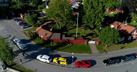 Aerial view and a pull back revealing small boat harbor including a Ferrar Stock Footage