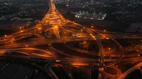 Aerial view and Top view. Traffic of expressways, motorways and highways at nigh Video stock 105356715