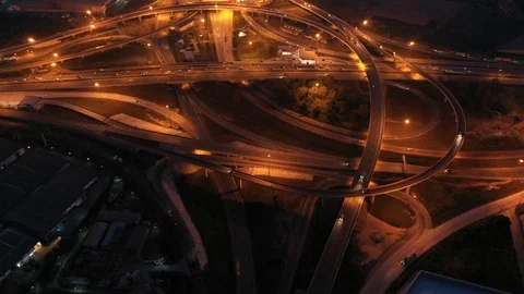 Aerial view and Top view. Traffic of expressways at night, motorways and highway Stock-Footage 106668028