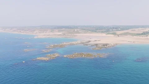 Aerial view of Anse du Croc in Frehel, Brittany, France, showcasing a wide sandy Stock Footage 346673264