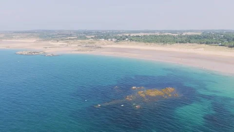Aerial view of Anse du Croc beach in Frehel, Brittany, France, showing a wide Stock Footage 346675737