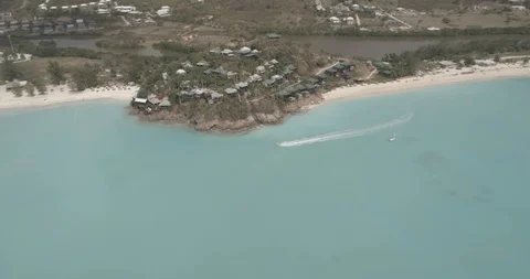 Aerial view of Antigua while Jet Ski cruises (Raw) Stock Footage 101398481