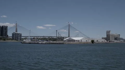 Aerial View of Anzac Bridge Spanning Water With Sydney Cityscape in Background Stock Footage 341314689