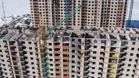 Aerial view of apartment building at structural construction stage Stock Footage 328077971