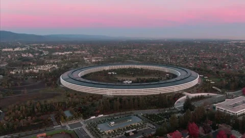 Aerial view of Apple Park at dusk, surrounded by trees. , Cupertino, USA Stock Footage 317536269