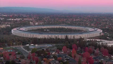 Aerial view of Apple Park at dusk, surrounded by trees. , Cupertino, USA Stock Footage 317536285