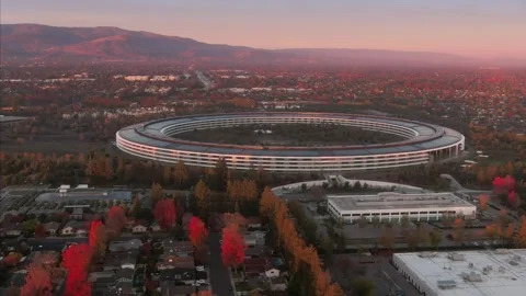 Aerial view of Apple Park at dusk, surrounded by trees. , Cupertino, USA Stock Footage 317536667