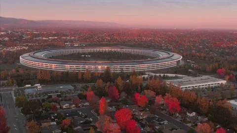 Aerial view of Apple Park at dusk, surrounded by trees. , Cupertino, USA Stock Footage 317536994