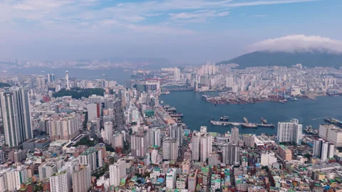 Aerial view approaching the Busan harbor and city center, summer day in Korea Stock Footage 346889613