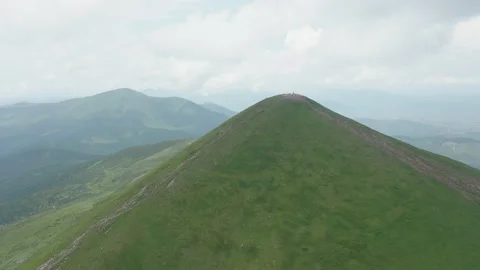 Aerial view of the approaching mountain peak against the backdrop of a beautiful Stock Footage 157579768