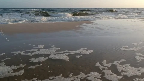 Aerial View Approaching Waves Over the Beach at Sunset Stock Footage 129244327