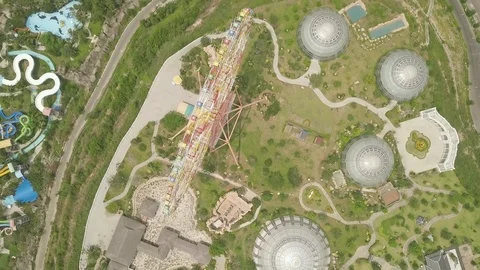 Aerial view aqua park and ferris wheel in amusement park on sea shore. Ferris Stock Footage 106986453