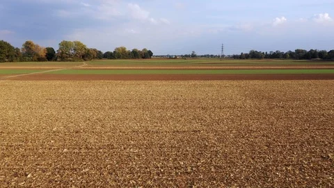 Aerial view of of arable fields. Alternately, harvested corn, ready for Stock Footage 118665976