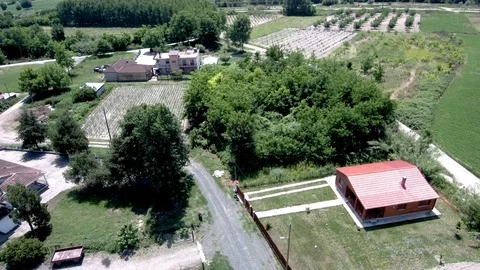 Aerial view of arable land with small village in Aridaia Greece Stock Footage 115048915