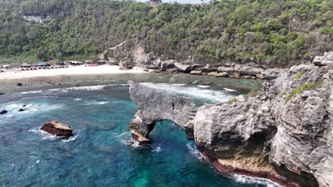 Aerial view of arc, Atuh Beach is a true hidden gem in Nusa Penida, Indonesia Stock Footage 320106766