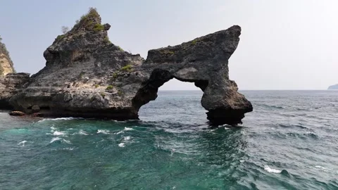 Aerial view of arc, Atuh Beach is a true hidden gem in Nusa Penida, Indonesia Stock Footage 320106819