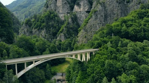 Aerial view of the arched bridge connecting a mountain road in the Romanian 스톡 동영상 120366710