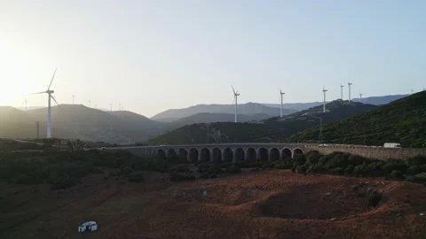 Aerial view arched bridge, sunset and windmills. Spain Stock Footage 236014790
