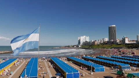 Aerial view of the Argentinian flag in the foreground and crowded Stock Footage 325756556