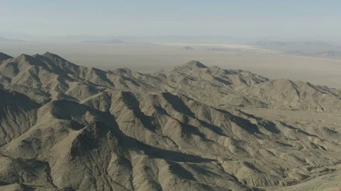 Aerial view of arid Mountain Range Mojave desert a remote Extreme Terrain Stock Footage 76853418