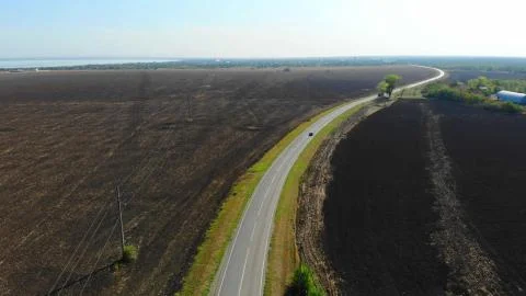 Aerial view of aroad between the fields. Stock Photos