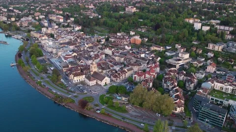 An aerial view around the old town of the city Évian-les-Bains Видео 309043387