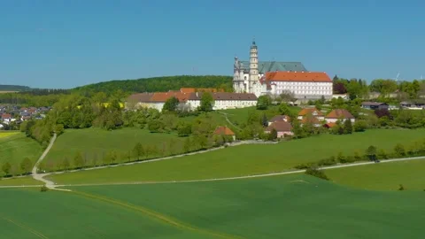 Aerial view around the old town and monastery of the city Neresheim in Bavaria Vídeos de archivo 337450205