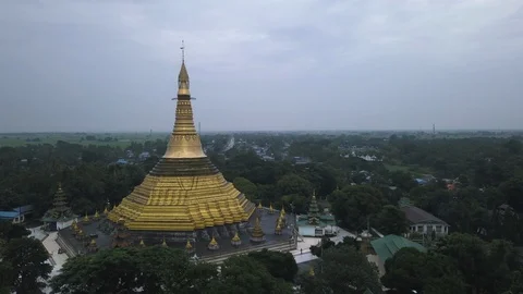 Aerial view around a pagoda in a small city in Myanmar Stock Footage 95617543