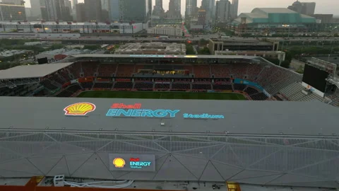 Aerial view around the Shell Energy Stadium, tilting toward the Houston Video stock 246652517