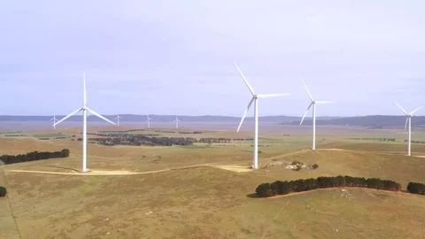Aerial view of an array of large wind turbines Stock Footage 121095751