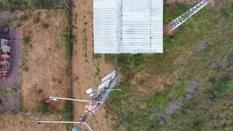 Aerial view of array of towers mast antennas station in the African bush Video stock 305124005