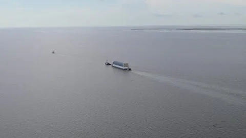 Aerial view  Artemis II Rocket Stage being transported by NASA's Pegasus Barge Stock Footage 281241717