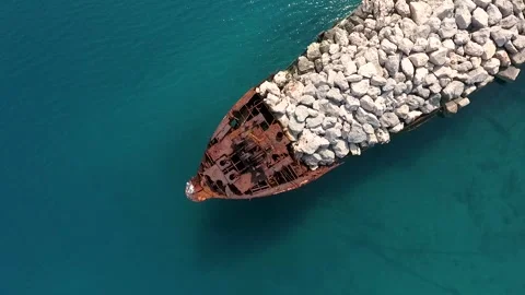 Aerial View of artificial pier with rusty ship bow, Nerezine. Stock Footage 345225093