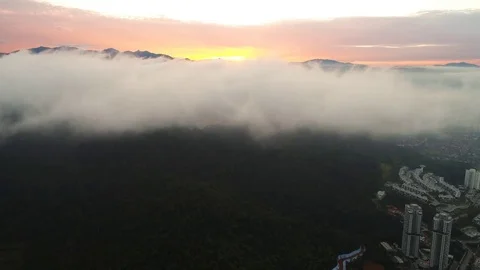 Aerial view. Ascending above the clouds seeing the sun rise above the horizon. Vídeos de archivo 81224863