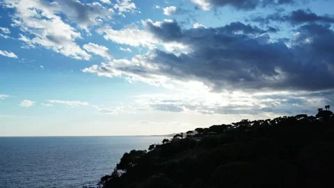 Aerial view from an ascending drone of cloudscape and sea horizon, 4K Stock Footage 274843708