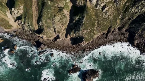 Aerial view of Atlantic Ocean waves breaking on the rocks, Setubal, Portugal. Stock Footage 152745334