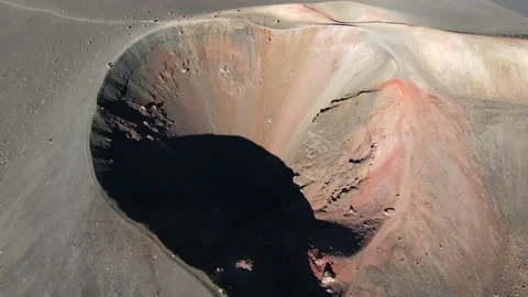 Aerial view atop multi-colored volcano crater during sunrise in Hawaii, drone 4K Video stock 196909852