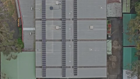 Aerial View of Australian Data Center Roofs with Solar Panels in Urban Setting Stock Footage 342037470