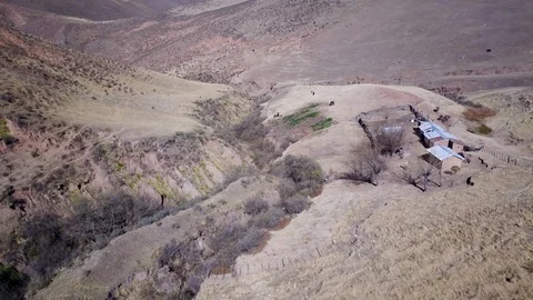 Aerial view of authentic mountain clay house and surroundings, dolly aerial shot Stock Footage 89819175