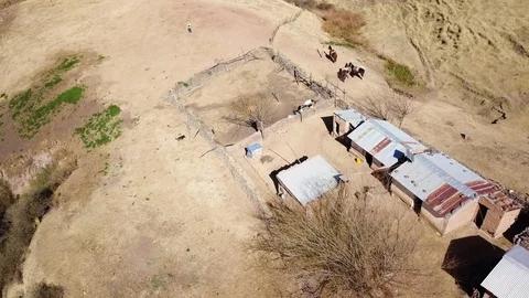 Aerial view of authentic mountain house and animals, crane aerial shot Stock Footage 89858634